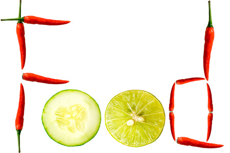 Fresh red peppers ,lemon and sliced cucumber isolated on white background.の写真素材