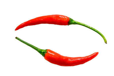 Fresh red peppers isolated on white background.の写真素材