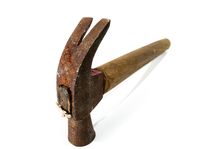 a tool with a heavy metal head mounted at right angles at the end of a handle, used for jobs such as breaking things and driving in nailsの写真素材