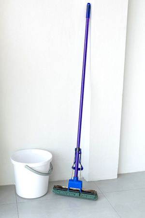 Mop purple And white water tank on white background.の写真素材