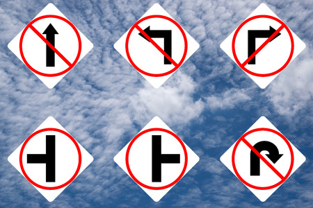 Set of traffic white signs on blue sky background.の写真素材