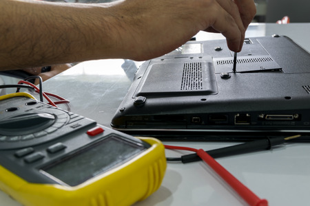 Technicians are repairing a notebook.の写真素材