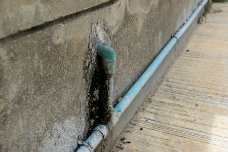 Water pipes on the vintage stone wall.の写真素材