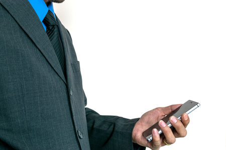 Young businessman using a smart phone to run his business.の写真素材