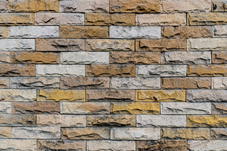 Colorful vintage stone wall texture background.