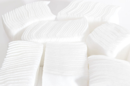 fluffy wedding of a kind originally made from raw cotton, used for cleansing wounds, removing cosmetics, and padding delicate objects.の写真素材