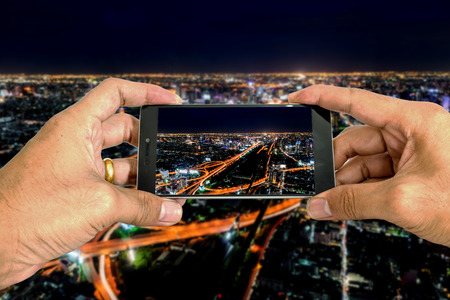 Take a city picture by smart phone.の写真素材