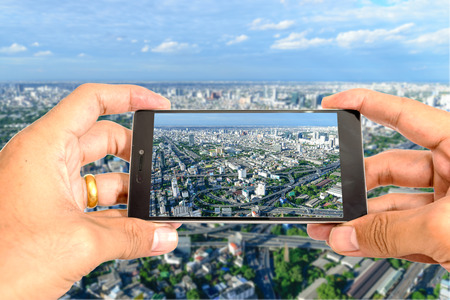 Take a city picture by smart phone.の写真素材