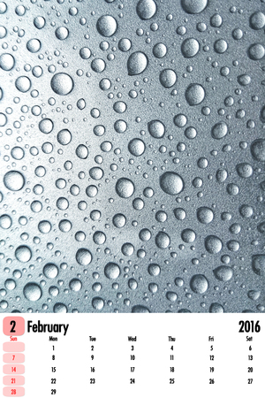 2016 calendar on rain drops color texture background.の写真素材