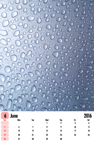 2016 calendar on rain drops color texture background.の写真素材