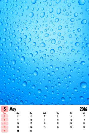 2016 calendar on rain drops color texture background.の写真素材