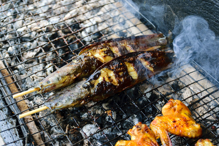 Grilled fish on the barbecue in the market.の写真素材