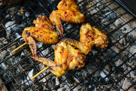 Grilled chicken on the stove in the market.の写真素材