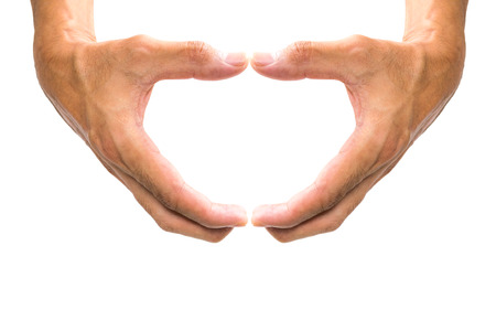 Making a heart shape with the hand symbol.の写真素材
