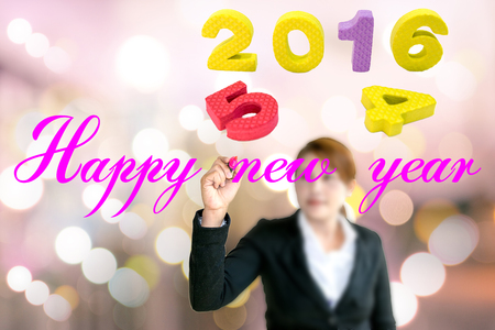 Young business woman write a greeting Happy New Year.の写真素材