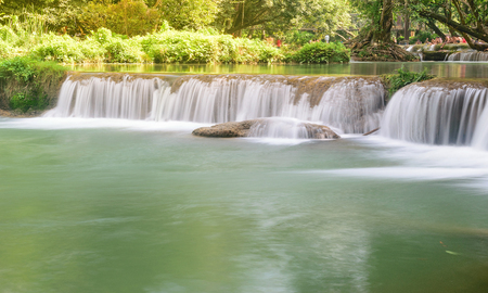 Beauty waterfall flows down from the mountains.の写真素材