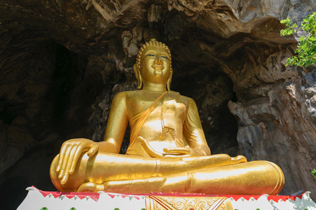 Golden Buddha statue in the temple of Thailand.の写真素材