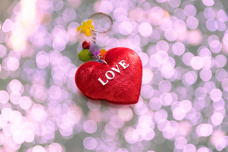 Red heart shaped on colorful background sign for love and valentine days.