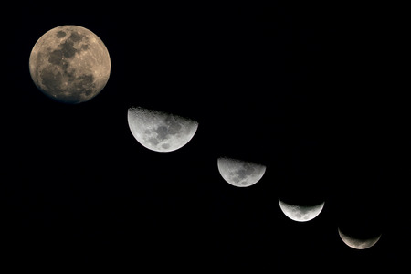 The full moon in the night sky is blue.の写真素材