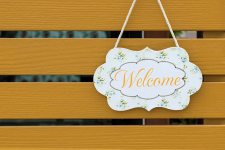 Welcome sign board for a welcome sign hanging in front of shops or offices.の写真素材