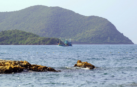 Fishing boats floating in the sea.の写真素材