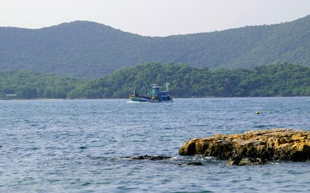 Fishing boats floating in the sea.の写真素材
