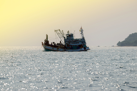Fishing boats floating in the sea.の写真素材
