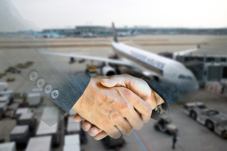 Business men and women shaking hands with each other to work together.の写真素材