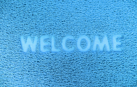 Welcome plastic red door capet texture background.の写真素材