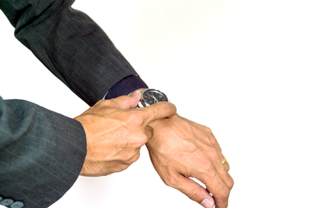 Businessman looking at his wristwatch, it was time to work yet.の写真素材