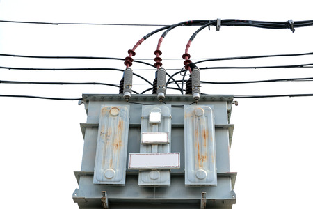High voltage transformers on utility poles.
