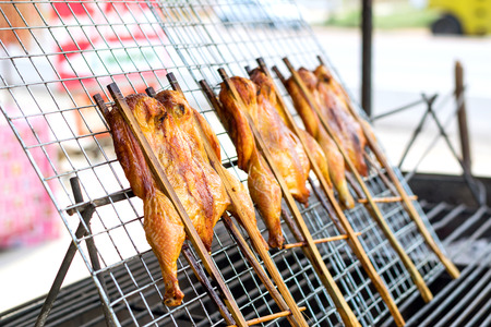 Roasting chicken,grilled chicken for sale in the market.の写真素材