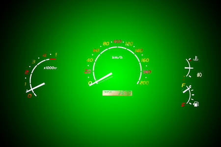 The speedometer of a car on a green color background.の写真素材