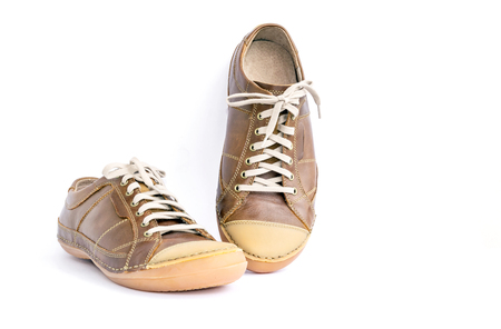 Brown leather shoes isolated on white background.の写真素材