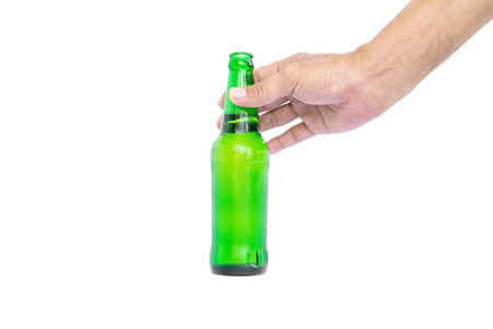 Hand holding the glass bottles for beer, alcohol or other beverage industry isolated on white background.の写真素材