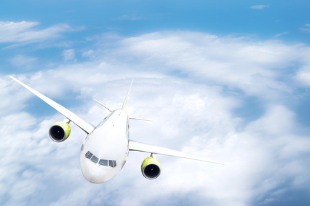 Front view of the passenger aircraft  on blue sky background.の写真素材