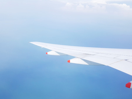 The view from the window of the plane while flying in the sky.