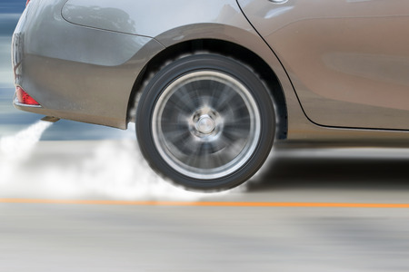 The show car was drifting on the racetrack and cause smoke from the exhaust and tire friction with the ground.の写真素材