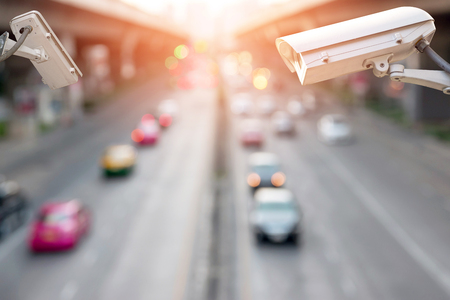 Closeup of traffic security camera surveillance (CCTV) on the road in the big city.の写真素材