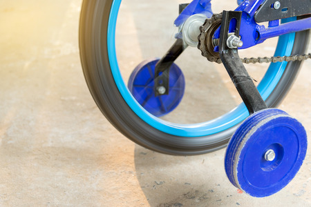 Closeup of spinning children bicycle chain wheel.