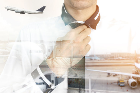 Double exposure of businessman in white shirt on the airport runway background.の写真素材