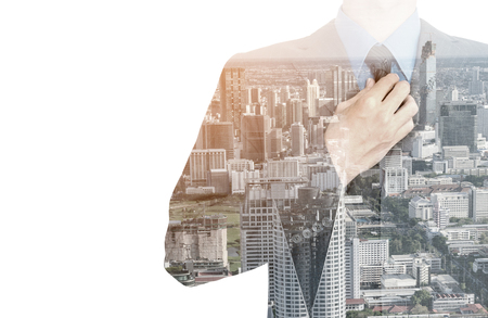 Double exposure of businessman in suit on city background.の写真素材