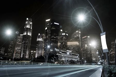 The beauty of car lights and street lighting with lens flare effect at night on the road in the city.の写真素材