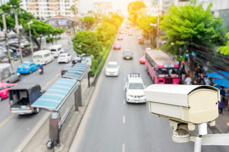 Closeup of traffic security camera surveillance (CCTV) on the road in the big city.