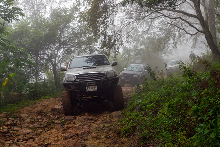 Phetchabun,Thailand-Aug 13,2016: Off road pickup truck was cruising in the forest on a mountain of Phetchabun province, Thailand.のeditorial素材