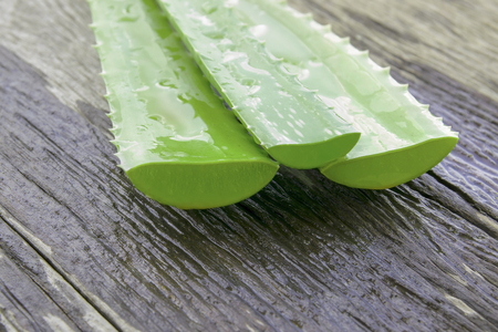Closeup Aloe Vera leaves on wooden background.の写真素材