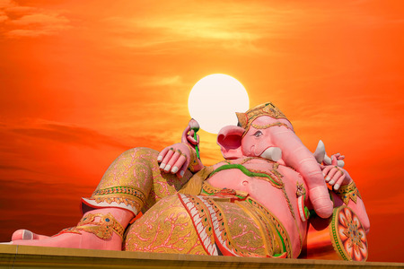 Ganesh statue  the largest in the world with the sunset and red sky background.の写真素材