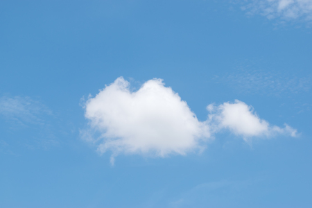White clouds on a blue sky on a clear day.の写真素材