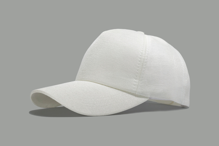 Closeup of the fashion white cap isolated on gray background.の写真素材