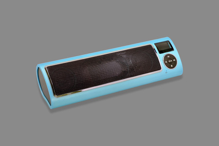 Wireless Bluetooth loudspeaker, mp3 player and radio for computer notebook and smart phone on gray background.の写真素材